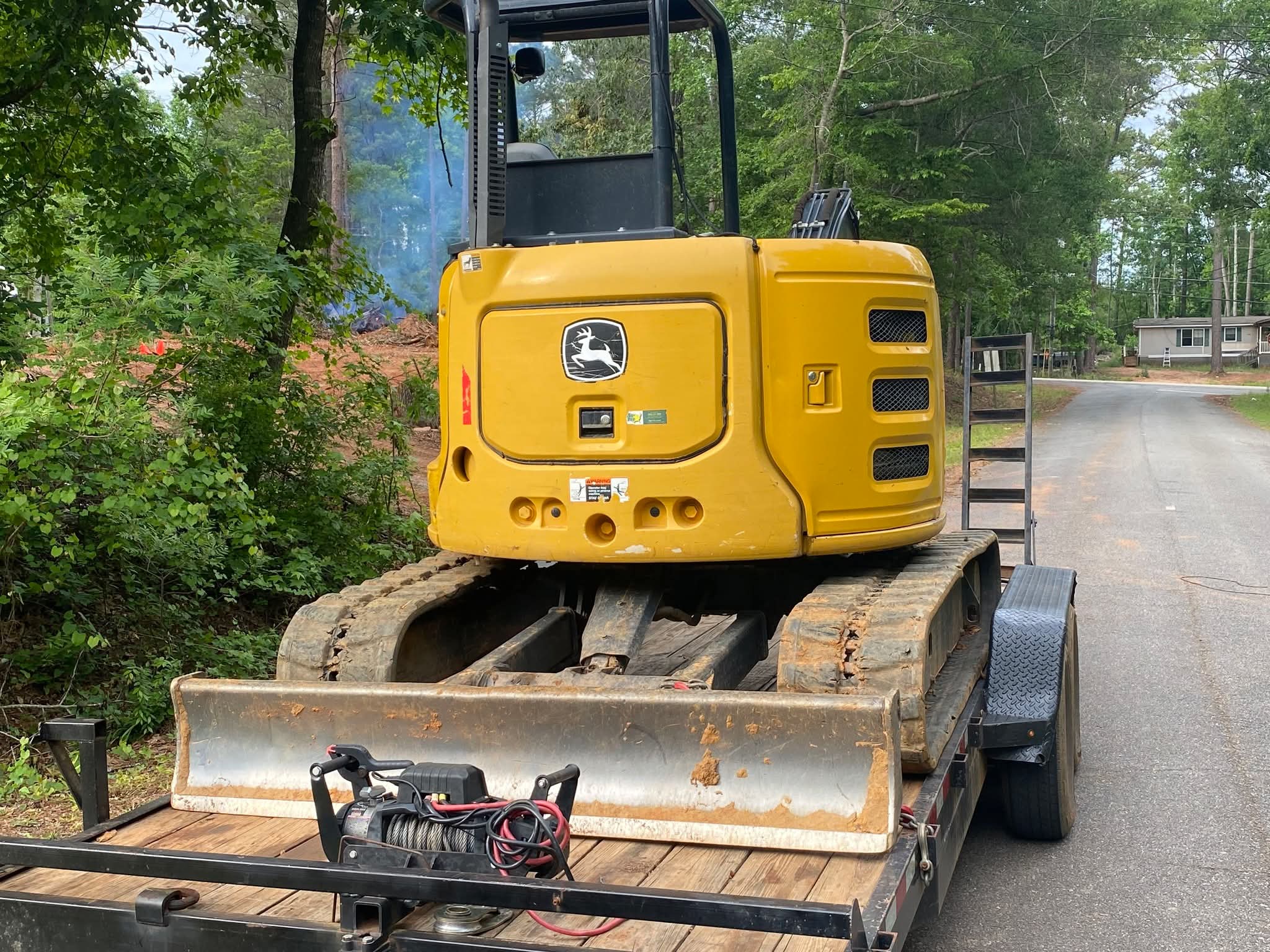 John Deere excavator on trailer